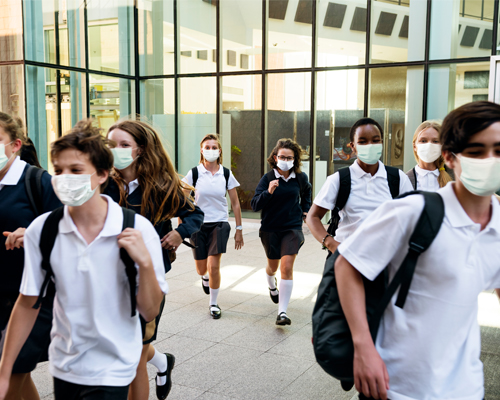 High School students in masks leaving school